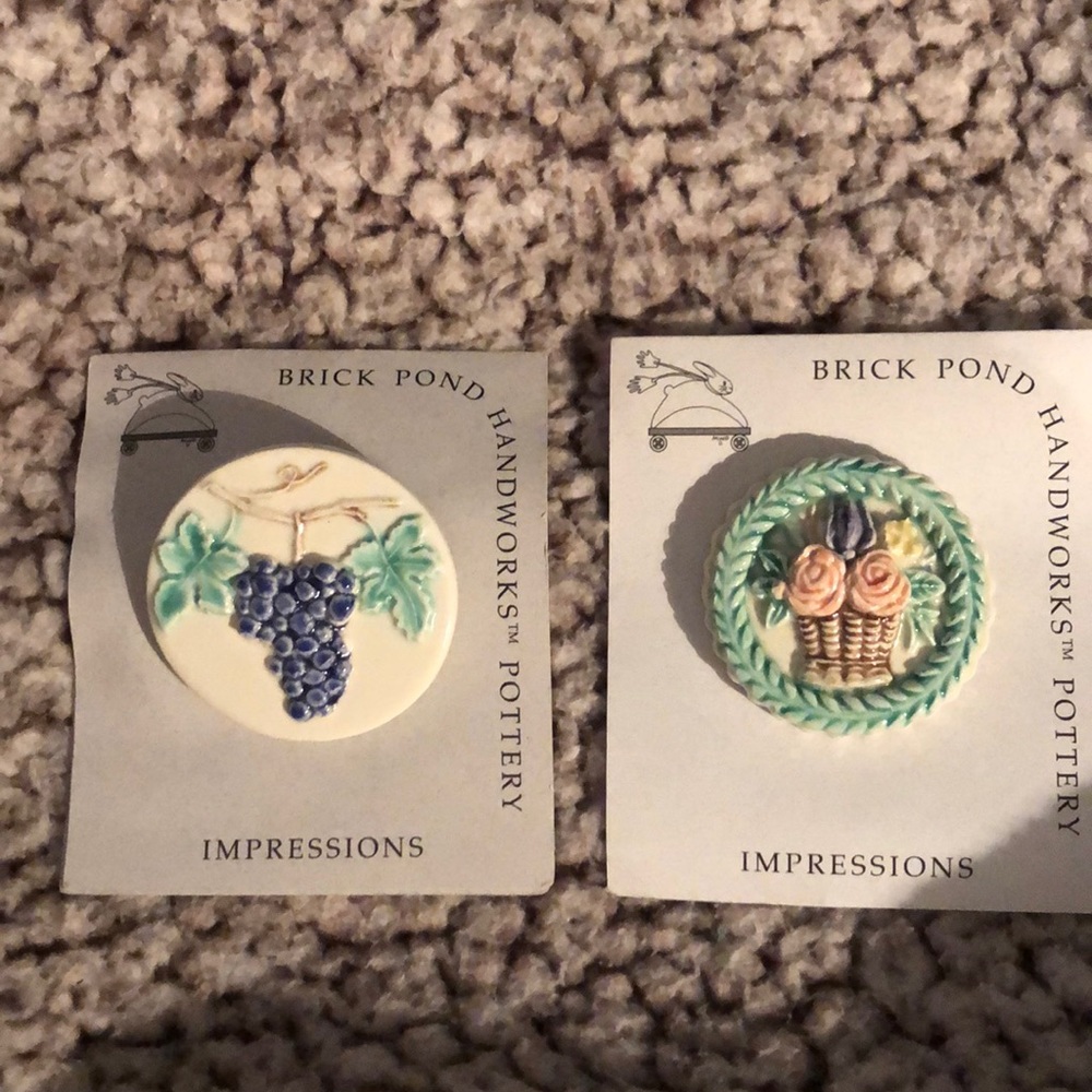 Two handcrafted brooches